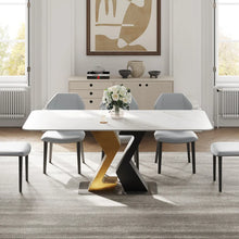 Charger l'image dans la galerie, Contemporary white rectangular dining table with striking black and gold angular geometric base, complemented by sleek gray dining chairs