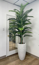 Load image into Gallery viewer, Realistic artificial palm tree in an elegant textured white planter, set in a modern office space with a mirrored door backdrop and wooden flooring.