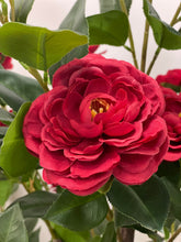 Charger l'image dans la galerie, Close-up of a vibrant artificial red flower with detailed petals and lush green leaves, ideal for realistic floral arrangements in any setting.