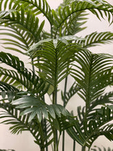 Charger l'image dans la galerie, Close-up of artificial palm fronds, showcasing vibrant green leaves and realistic detailing, ideal for indoor decoration.