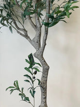 Charger l'image dans la galerie, Close-up of the detailed trunk and branches of an artificial olive tree with a textured, lifelike appearance. A green tag with the brand name "Waysaving" is attached to one of the branches. The tree features realistic bark textures and connected branches, making it a convincing decorative piece for indoor settings.