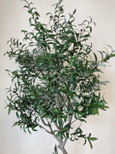 Charger l'image dans la galerie, Close-up view of the artificial olive tree's leaves and small dark olives, showing the detailed texture and realistic design of the foliage against a neutral background