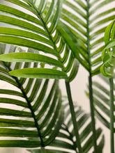 Charger l'image dans la galerie, Close-up of vibrant green artificial palm leaves, showcasing their detailed texture and lush tropical aesthetic, perfect for enhancing indoor decor with a natural touch.