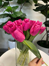 Load image into Gallery viewer, A delicate bouquet of artificial red tulips displayed in a clear glass vase, set against a lush green background. How do I choose the right vase for displaying artificial flowers?