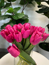 Load image into Gallery viewer, A delicate bouquet of artificial red tulips displayed in a clear glass vase, set against a lush green background. How do I choose the right vase for displaying artificial flowers?