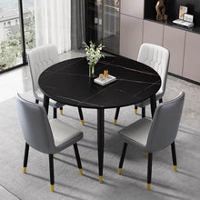 Charger l'image dans la galerie, What is the best size for a small dining table? Image of a compact round black marble dining table with gold accents, paired with four grey leather chairs in a modern dining room, designed for smaller spaces.