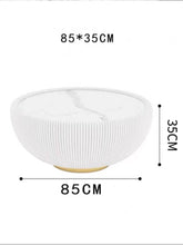 Load image into Gallery viewer, What size coffee table is best for a modern living room? This round white coffee table with ribbed detailing measures 85 cm in diameter and 35 cm in height, making it an ideal choice for contemporary spaces. The table features a sleek gold base and a minimalist design, perfect for adding both functionality and style to your living room.