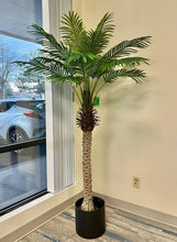Charger l'image dans la galerie, A large artificial palm tree in a stylish office corner by the window, adding a natural touch to a professional setting.