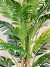 Charger l'image dans la galerie, Close-up of vibrant green artificial palm leaves, showcasing their detailed texture and lush tropical aesthetic, perfect for enhancing indoor decor with a natural touch.