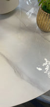 Load image into Gallery viewer, Close-up of a glossy white marble tabletop with subtle gray veining, featuring a gold decorative planter, highlighting the smooth, elegant finish of the marble surface