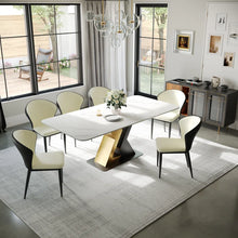Charger l'image dans la galerie, Modern dining table with a sleek white top and a unique gold and black geometric base, perfect for contemporary dining rooms and stylish home interiors.
