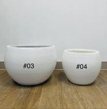 Charger l'image dans la galerie, white cement round planters with a smooth finish, placed indoors on a carpeted floor near a window. What are the dimensions and weight of these planters?