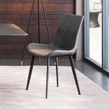 Charger l'image dans la galerie, Modern minimalist dining chair with a sleek black frame and dark gray upholstered seat. Common questions include 'What materials are best for dining chairs?' and 'Are leather dining chairs comfortable for everyday use?
