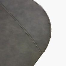 Charger l'image dans la galerie, Close-up detail of a dark gray faux leather dining chair seat with fine stitching. Common questions include 'What material is best for dining chair upholstery?' and 'How do you clean faux leather dining chairs?