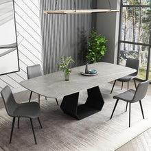 Charger l'image dans la galerie, A sleek, dark gray faux leather dining chair with black metal legs, placed next to a black dining table. Frequently asked questions include 'Are faux leather chairs durable for everyday dining?' and 'What are the best ergonomic features for dining chairs?