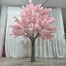 Charger l'image dans la galerie, A stunning artificial pink cherry blossom tree displayed in a showroom with a white curtain backdrop. How durable are the blossoms against prolonged use and handling?