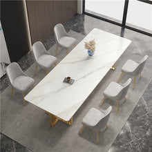 Load image into Gallery viewer, Modern dining setup featuring a long marble dining table paired with six gray velvet chairs and gold legs, perfect for large family gatherings. Common questions include ‘Are marble dining tables worth it?’ and ‘How do you maintain velvet chairs in high-traffic areas?