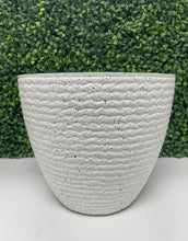 Charger l'image dans la galerie, Textured white planter with a speckled finish displayed in front of a green leafy backdrop. Frequently asked questions: What materials are these planters made from? Are these planters suitable for both indoor and outdoor use? How to clean and maintain decorative planters?