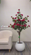 Charger et lire la vidéo dans la visionneuse de la Galerie, Artificial red flowers in a modern white planter, ideal for adding a vibrant touch to indoor spaces such as living rooms or offices
