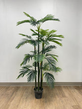 Charger l'image dans la galerie, High-quality artificial palm tree in a black planter, placed on a wooden floor against a minimalist white wall, perfect for indoor office or home décor.