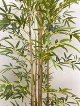 Charger l'image dans la galerie, Close-up view of artificial bamboo plant with lifelike green leaves and detailed stalks, ideal for enhancing home or office decor with a touch of nature