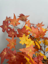 Load image into Gallery viewer, Close-up of vibrant artificial autumn maple leaves in shades of red, orange, and yellow, showcasing detailed veins and texture