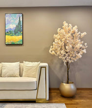 Charger l'image dans la galerie, Elegant artificial cherry blossom tree in a gold planter, adding a luxurious and serene touch to modern living spaces.