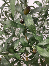 Load image into Gallery viewer, Close-up of artificial olive tree leaves, showcasing the detailed veining and texture of the green foliage, with a few black olives visible in the background