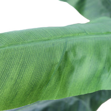 Load image into Gallery viewer, Close-up of an artificial banana leaf, showcasing the realistic texture and vibrant green color, perfect for tropical-themed indoor decor.
