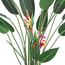 Load image into Gallery viewer, Close-up view of an artificial Bird of Paradise plant showing the vibrant orange and yellow flowers nestled among tall green stems and large, glossy green leaves