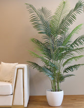 Charger l'image dans la galerie, Artificial palm tree in a modern white pot, perfect for adding a tropical touch to indoor spaces with its lush green foliage.