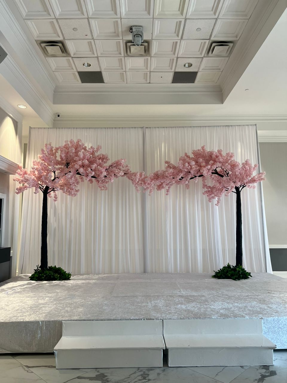 Create a Dreamy Event Setting with an Arched Light Pink Cherry Blossom Tree