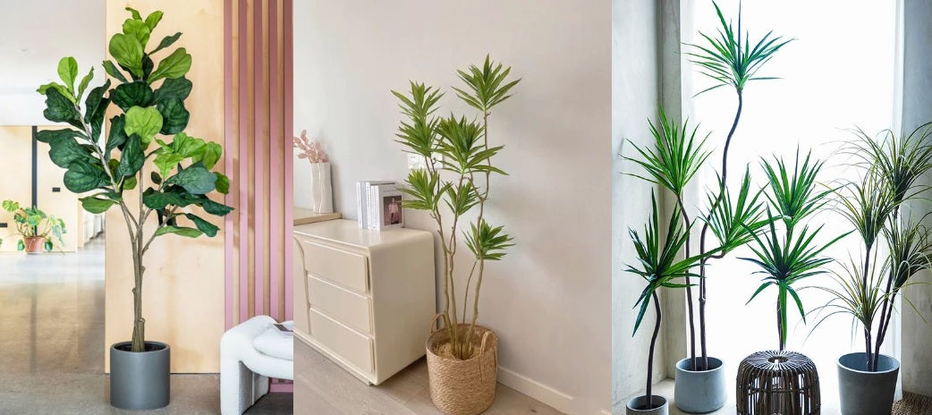 a variety of artificial trees and plants in beautiful pots.