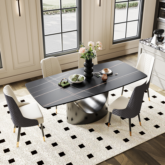 Modern round table with a sleek black surface and subtle gold accents, featuring a unique metallic base design. Ideal for contemporary dining spaces, offering both style and functionality.