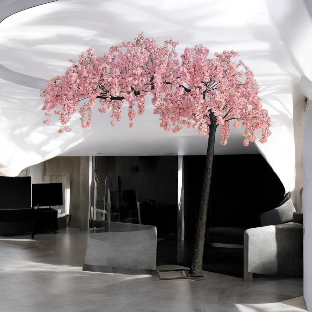 Artificial pink weeping cherry blossom  arch tree with pink flowers in a modern indoor setting