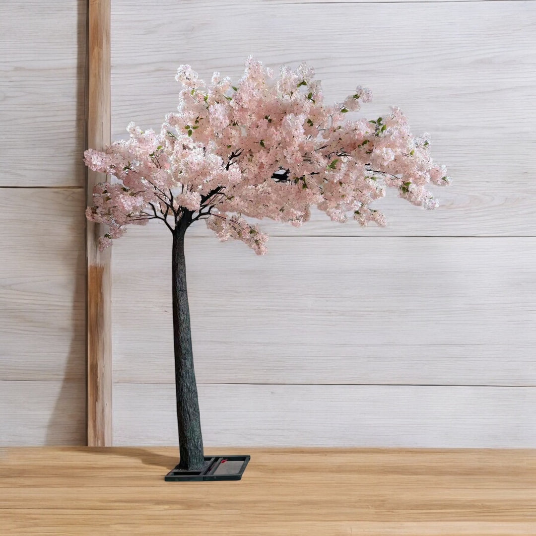 Floral wedding arch tree featuring white and blush pink cherry blossoms