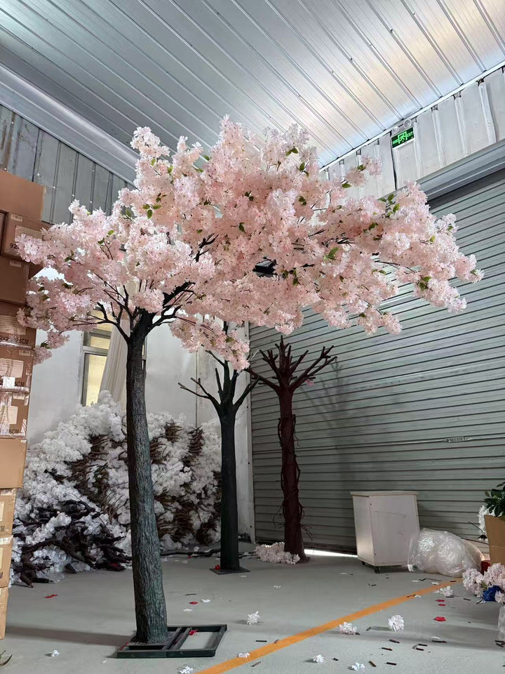 Event-ready cherry blossom floral arch with lifelike blossoms and sturdy frame stored in warehouse.