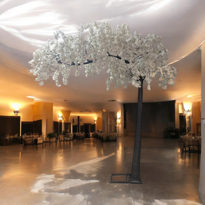 Cascading branches of a 10 ft white artificial cherry blossom tree