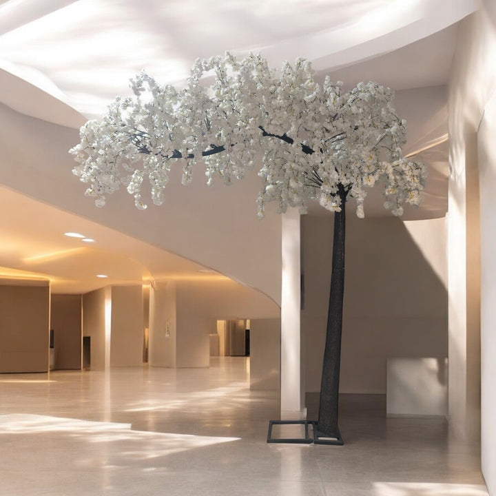 10 ft white arch cherry blossom tree displayed as an elegant event centerpiece
