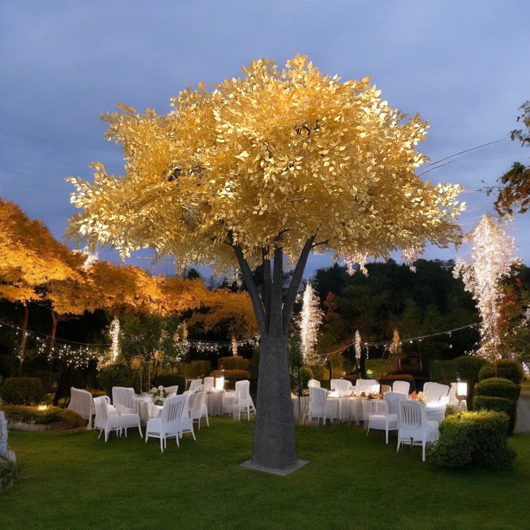 Decorative ficus tree with lights in an outdoor setting with chairs and tables.