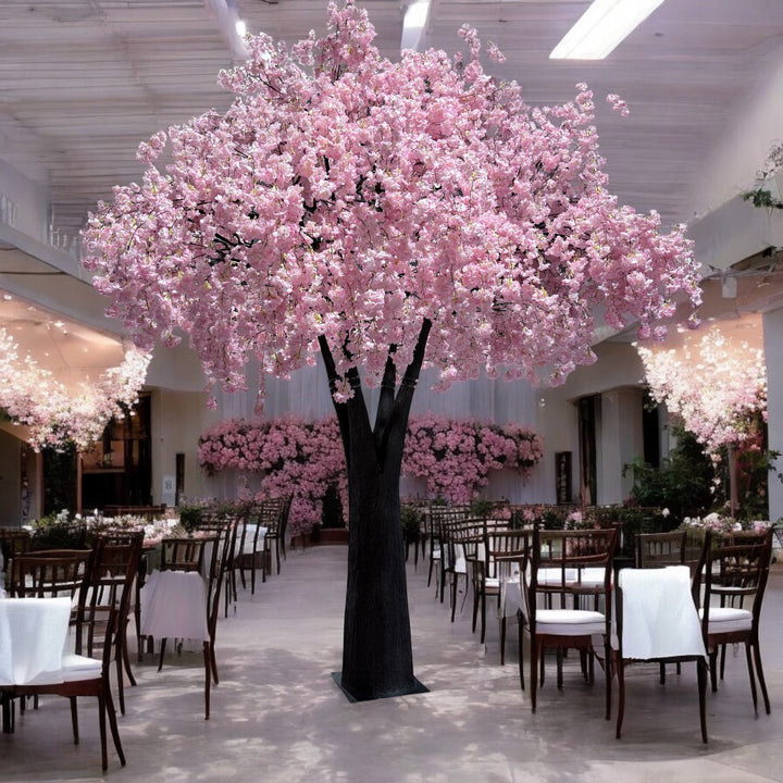 Tall pink weeping cherry blossom tree  with flowing cascading branches used as a centerpiece at a wedding in GTA.