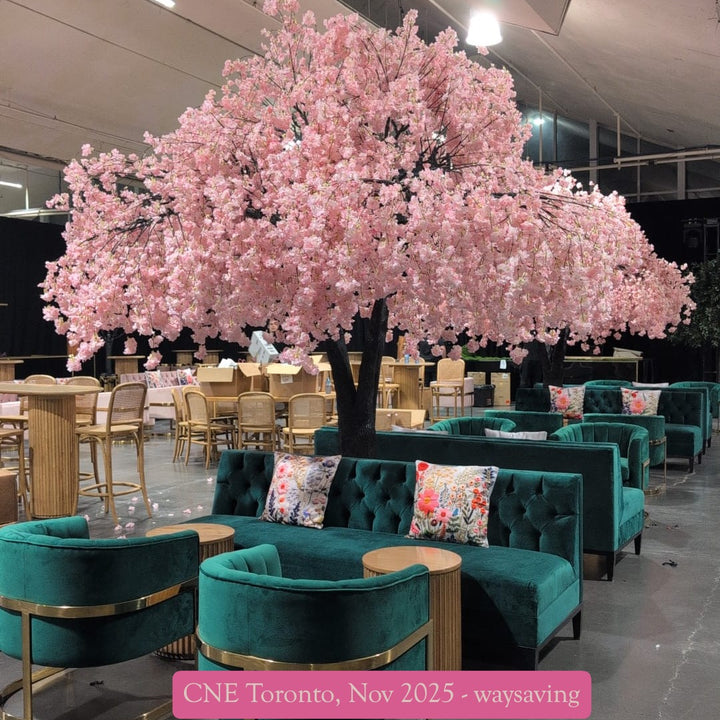 Elegant artificial pink weeping cherry blossom tree with cascading blooms set at an event venue in Toronto.