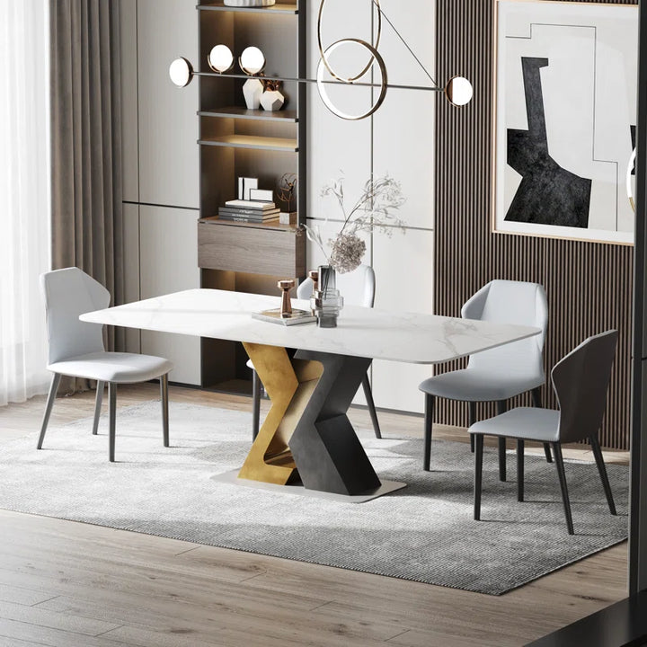 Modern dining table featuring a white marble top and a striking geometric base in gold and black, designed to enhance contemporary dining spaces with its stylish and elegant aesthetic