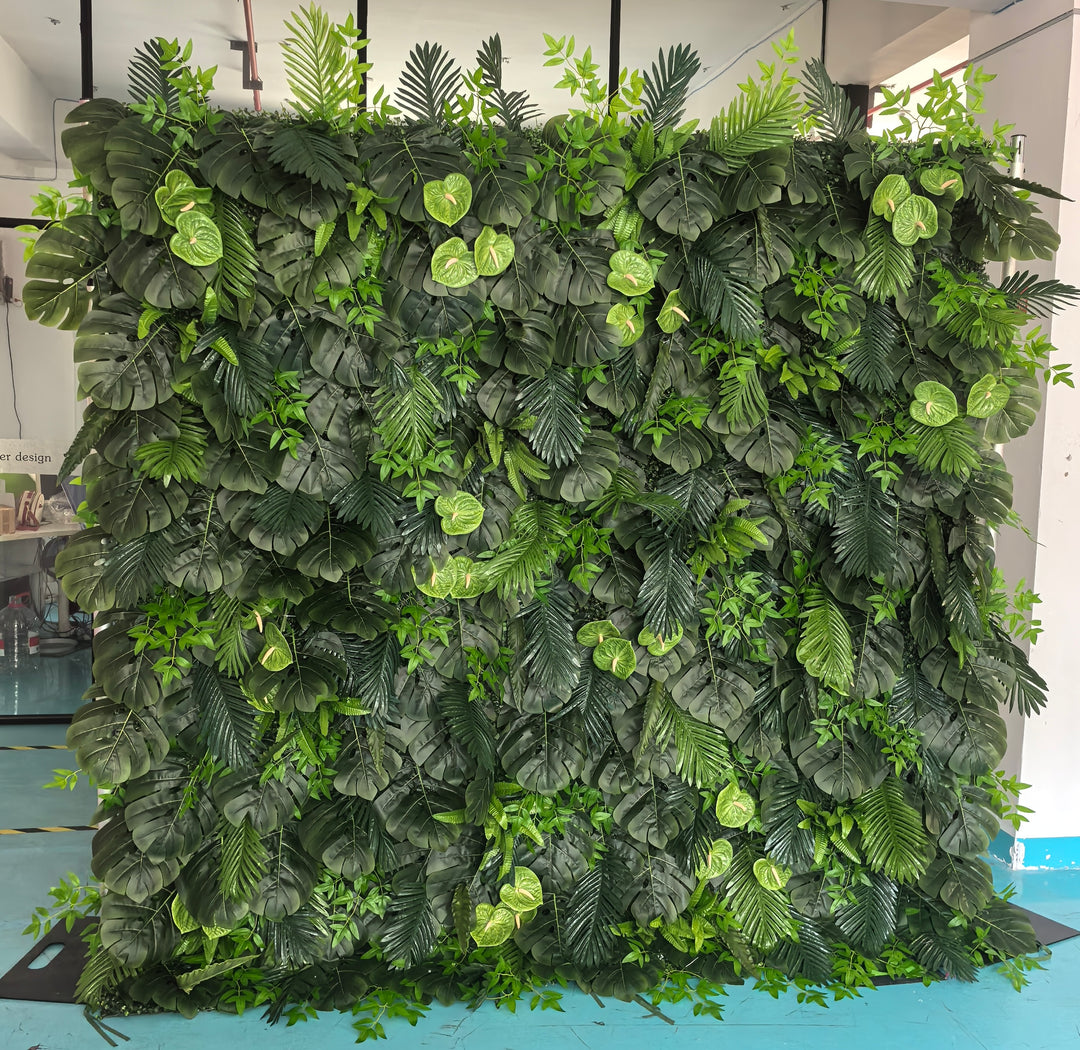 Artificial tropical leaf backdrop featuring a variety of lush green foliage, ideal for event decor, photo backdrops, and interior design. How suitable is this backdrop for outdoor events? Can this artificial green wall be used as a long-term decor solution?