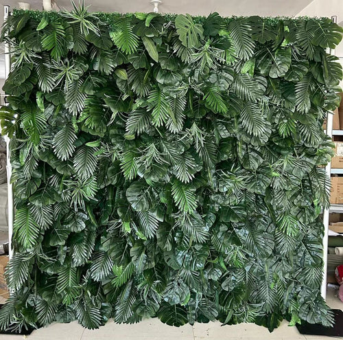 Lush green artificial foliage backdrop with a variety of tropical leaves, ideal for creating a natural jungle ambiance for events and photo sessions. How realistic is the texture and color of the leaves? Is this greenery wall suitable for outdoor installations? Can it be customized for different sizes or shapes?