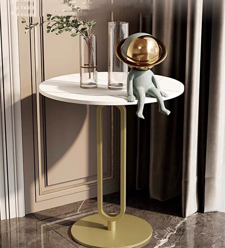 Contemporary white and gold side table with decorative accents, ideal for modern living spaces. Popular questions: 'What is the best material for a side table top?' 'How do I style a side table in a living room?' and 'What are the benefits of a minimalist side table design?