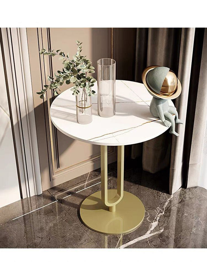 Contemporary white and gold side table with decorative accents, ideal for modern living spaces. Popular questions: 'What is the best material for a side table top?' 'How do I style a side table in a living room?' and 'What are the benefits of a minimalist side table design?