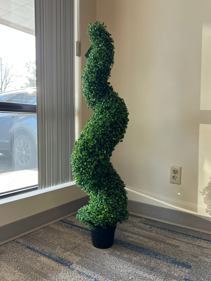 Elegant artificial spiral topiary in a sleek black pot, perfect for adding a touch of greenery and sophistication to indoor or outdoor spaces.