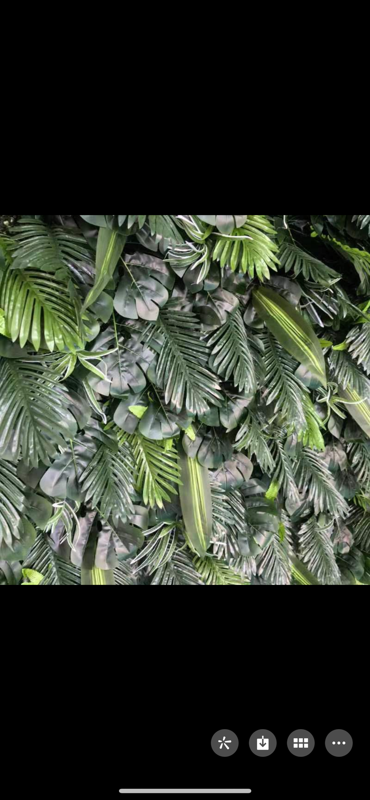 Lush green artificial foliage backdrop with a mix of tropical leaves. Ideal for weddings, parties, and corporate events as a photo backdrop or decorative wall. Is this backdrop easy to install and maintain? Does the greenery require any special care to retain its color and appearance over time?