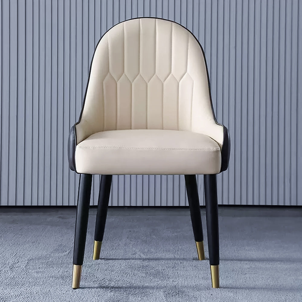 A modern beige upholstered dining chair with black legs and gold-capped feet, featuring a stylish hexagonal stitched backrest design, perfect for contemporary dining settings. Frequently asked questions might include 'What type of fabric is best for durable dining chairs?' or 'How do I maintain upholstered dining chairs over time?